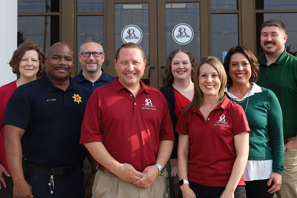 Security Bank team in front of building